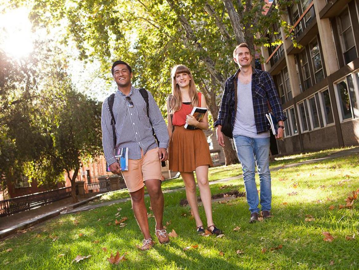 A group of students walking across campus