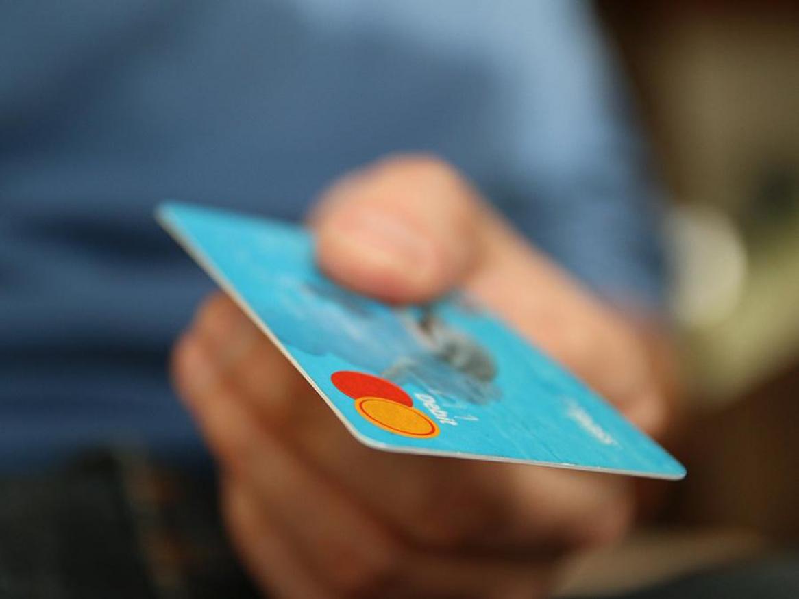 Hand holding a credit card